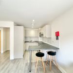 Modern kitchen with breakfast bar and stools