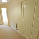 Hallway leading to bedrooms and bathroom