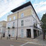 The Paragon Building exterior with street view.