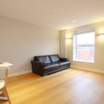 Minimalist room with sofa and dining table