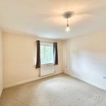Empty room with window and light fixture
