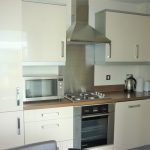 Modern kitchen with appliances and cabinets.