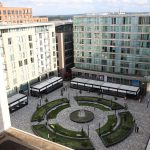 Modern city square with fountain and buildings