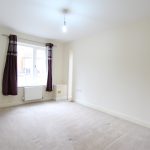 Empty room with window and purple curtains