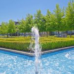 Fountain in modern landscaped courtyard with trees