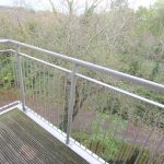Balcony view of trees and path