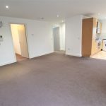 Spacious flat with open kitchen and living area.