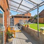 Sunny patio with seating and garden view