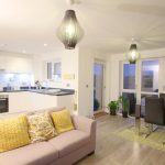 Modern open-plan kitchen living room with dining area.