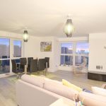 Modern living room with dining area and large windows