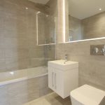 Modern bathroom with bathtub and vanity unit