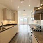 Modern kitchen with sleek design and appliances.