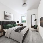 Modern bedroom with green accents and large window.