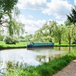 Narrowboat on a scenic English canal.