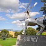 University of Surrey campus statue and landscape view.