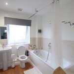 Modern bathroom with bathtub and window