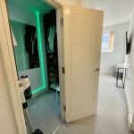 Modern room with open door and closet view