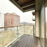 Urban view from modern apartment balcony