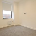 Empty room with carpet and window