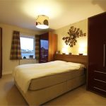 Comfortable bedroom with modern decor and double bed.