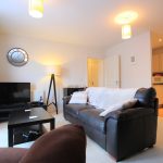 Modern living room with kitchen area