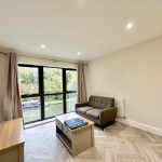 Bright living room with canal view.