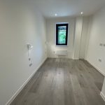 Empty room with wooden floor and window