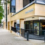 Midsummer Boulevard building with trees and pavement