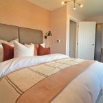 Modern bedroom with desk and comfortable bed