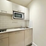 Compact kitchen with microwave and hob
