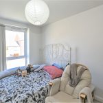 Cosy bedroom with teddy bears and bright window