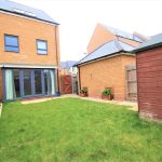 Modern house with garden and patio doors