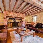 Cosy rustic living room with wooden beams.