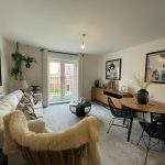 Modern living room with stylish decor and furniture.