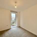 Empty room with window and light bulb.