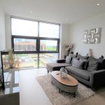 Modern flat living room with large window view