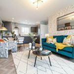 Modern living room with colourful decor and furnishings.