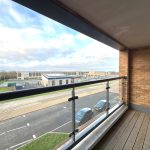 Balcony view of road and modern buildings