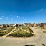 Modern housing development under clear blue sky.