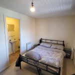 Bedroom with bed and ensuite bathroom