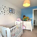 Child's nursery with cot and toys.