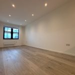 Empty room with wooden floor and window