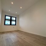 Empty room with wooden floor and window