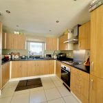 Modern kitchen with wooden cabinets.