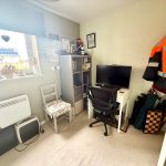 Small home office with desk and computer.