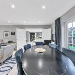 Modern open-plan living room with dining area.