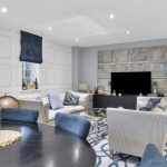 Modern living room with sofas and stylish decor.