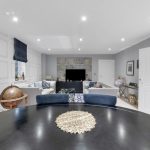 Modern living room with elegant decor and globe.