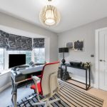 Modern home office with striped rug