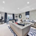 Elegant living room with modern furniture and decor.